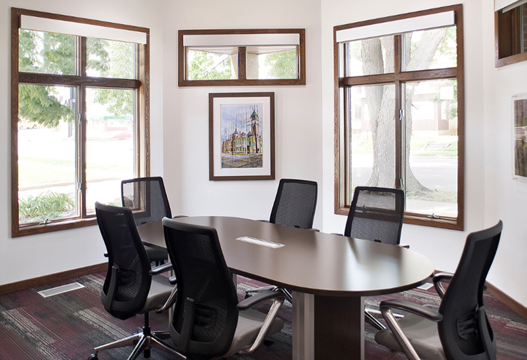 Small boardroom with windows surrounding the table