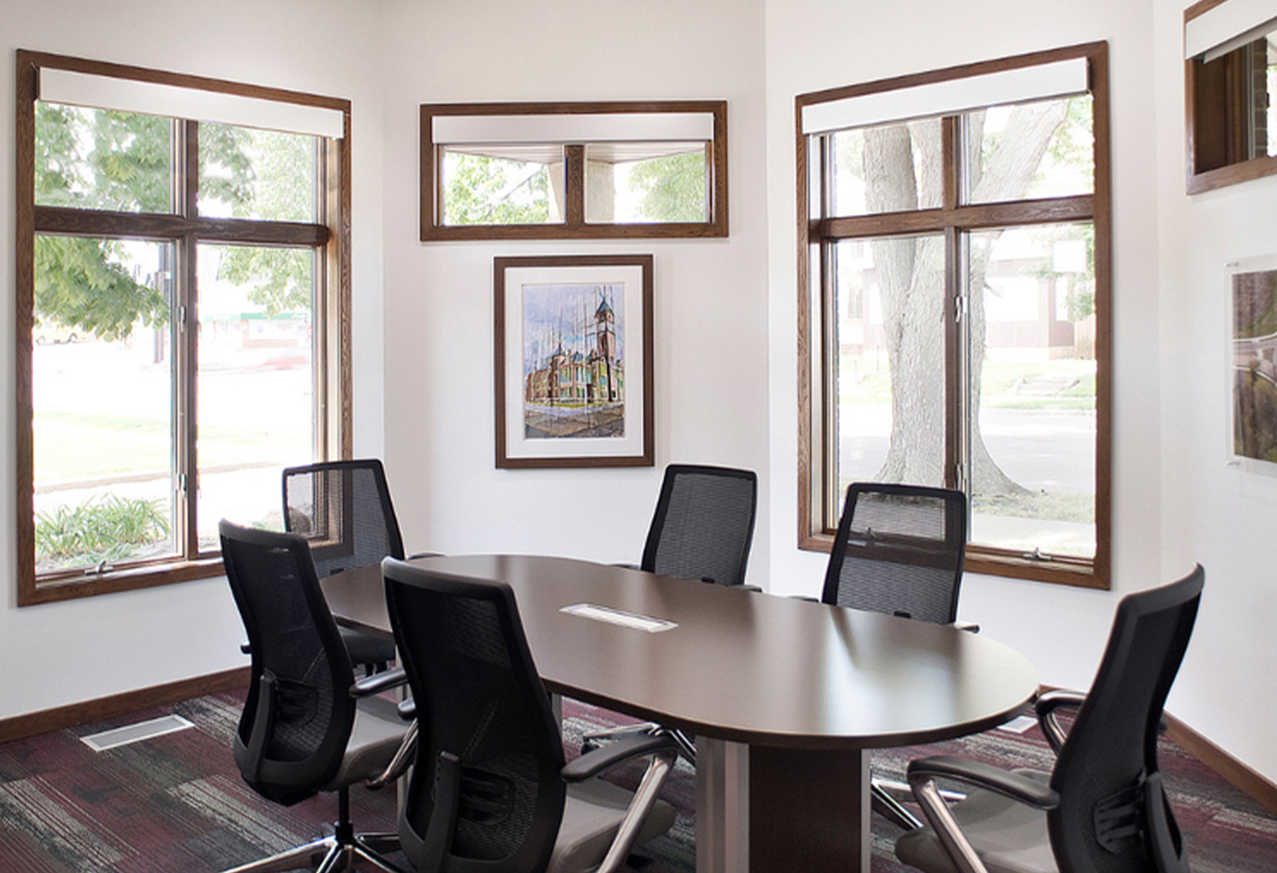 Small modern board room with windows
